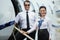 Happy Airhostess And Pilot Standing On Private