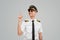 Happy airline pilot pointing up