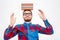 Happy amusing man in glasses with books on his head