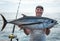 Happy angler with big tuna