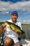 Happy Angler Fishing For Largemouth Bass