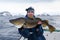 Happy angler with huge cod fish