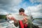 Happy angler with lake trout