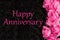 Happy Anniversary greeting with pink roses on black