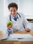Happy, apple and portrait of man doctor with stethoscope for positive, good and confident attitude. Smile, pride and
