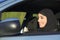 Happy arab saudi woman driving a car