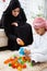 Happy Arabic child at home with his mother