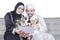 Happy Arabic family shopping online on tablet