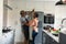 Happy arfican american senior couple dancing together in kitchen and having fun