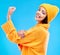 Happy, arm and portrait of a woman with muscle isolated on a blue background in a studio. Smile, strong and a girl