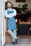 Happy, arms crossed and portrait of an Asian man at a restaurant for a welcome, service and job at the door. Smile