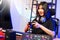 Happy asia girl gamer wear headphone competition play video game online with computer colorful neon light in living room at night