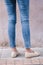 Happy Asia woman in bright blue skinny crop jeans, sky blue jeans