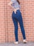 Happy Asia woman in navy blue skinny jeans, dark blue jeans