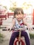 Happy asian baby child playing on playground, wink action