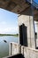 Happy asian boy jumping of concrete spillway into the canal on a hot summer day