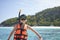 Happy Asian boy wearing snorkel and preparing for swimming in Phuket, Thailand