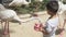 Happy of asian child is feeding food flamingo in zoo with excited, boy to travel for activity in summer