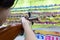 Happy asian child girl holding wooden gun,aim to the point,shooting the target,female playing shooting games for a carnival at