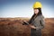 Happy asian contractor woman holding blueprint on clipboard