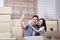 Happy asian couple moving into new home Take a smartphone and take a selfie.