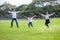 happy asian Family, parents and their children jumping together in park . father mother and son having fun and laughing outdoors