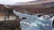 Happy Asian family travelers at hraunfossar waterfall in Iceland