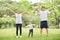 Happy Asian family workout at the park.