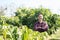 Happy Asian farmer in longan field, Thailand