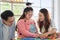 Happy asian father and mother playing education toy with their daughter down syndrome child in living room, Activity happy family