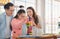 Happy asian father and mother playing education toy with their daughter down syndrome child in living room, Activity happy family