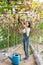 Happy asian girl in her garden,Little girl to harvesting pumpkin