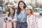 Happy asian girls making vlog video at bus station - Trendy friends blogging for social media outdoor - Technology lifestyle