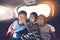 Happy Asian kids travelling in car.