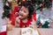 Happy Asian little girl with Christmas cake at home on winter holiday