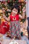 Happy Asian little girl with Christmas cake at home on winter holiday