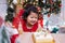 Happy Asian little girl with Christmas cake at home on winter holiday