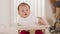 Happy asian newborn baby sit on baby chair smile and laughing with parent or family at home.Adorable baby boy cheerful enjoy with