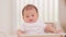 Happy asian newborn baby sit on baby chair smile and laughing with parent or family at home.Adorable baby boy cheerful enjoy with