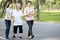 Happy asian old senior woman with her family having fun,strolling in outdoor city park,relax and enjoy,elderly grandmother with