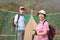 Happy asian senior couple walking on the bridge in