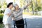 Happy asian senior woman practice walking using walker during rehabilitation,elderly people care,support her best friend,two