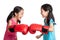 Happy Asian twins girls with boxing gloves