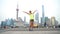 Happy Asian woman having fun jumping in fitness clothing - Shanghai city China