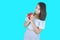 Happy Asian woman smile with gift box isolated on blue background. Teenage girls in love, Receiving gifts from lovers, birthday,