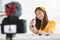 Happy Asian young beauty blogger girl training how to be make up artist in home studio. Woman speaking in front of camera as