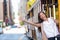 Happy Asian young woman excited having fun riding the popular tourist attraction tramway cable car system in San Francisco city,