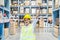 Happy asian young woman warehouse worker holding a trophy after being selected as an outstanding employee