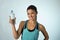 Happy and attractive latin sport woman in fitness clothes holding bottle drinking water smiling fresh and cheerful