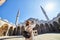 Happy attractive woman tourist in hat, posing and takin a photo in courtyard of Suleymaniye mosque, Istanbul, Turkey. Religion and